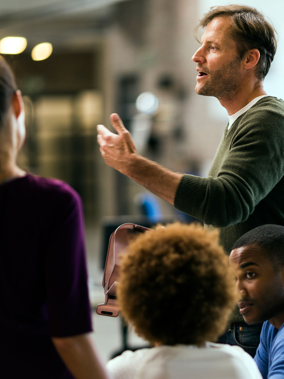 Man speaking to group gathering