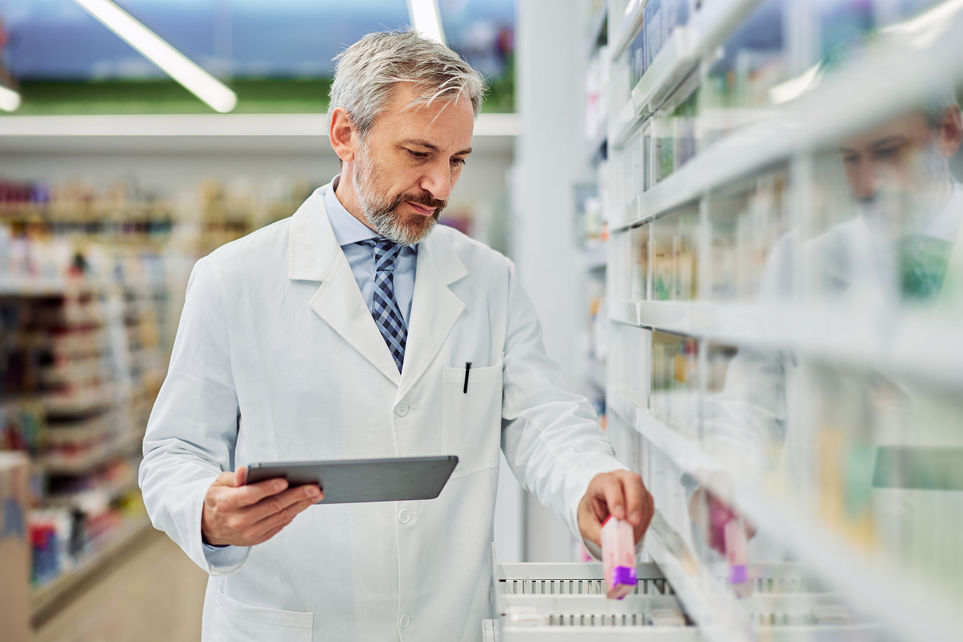 A pharmacist checking inventory