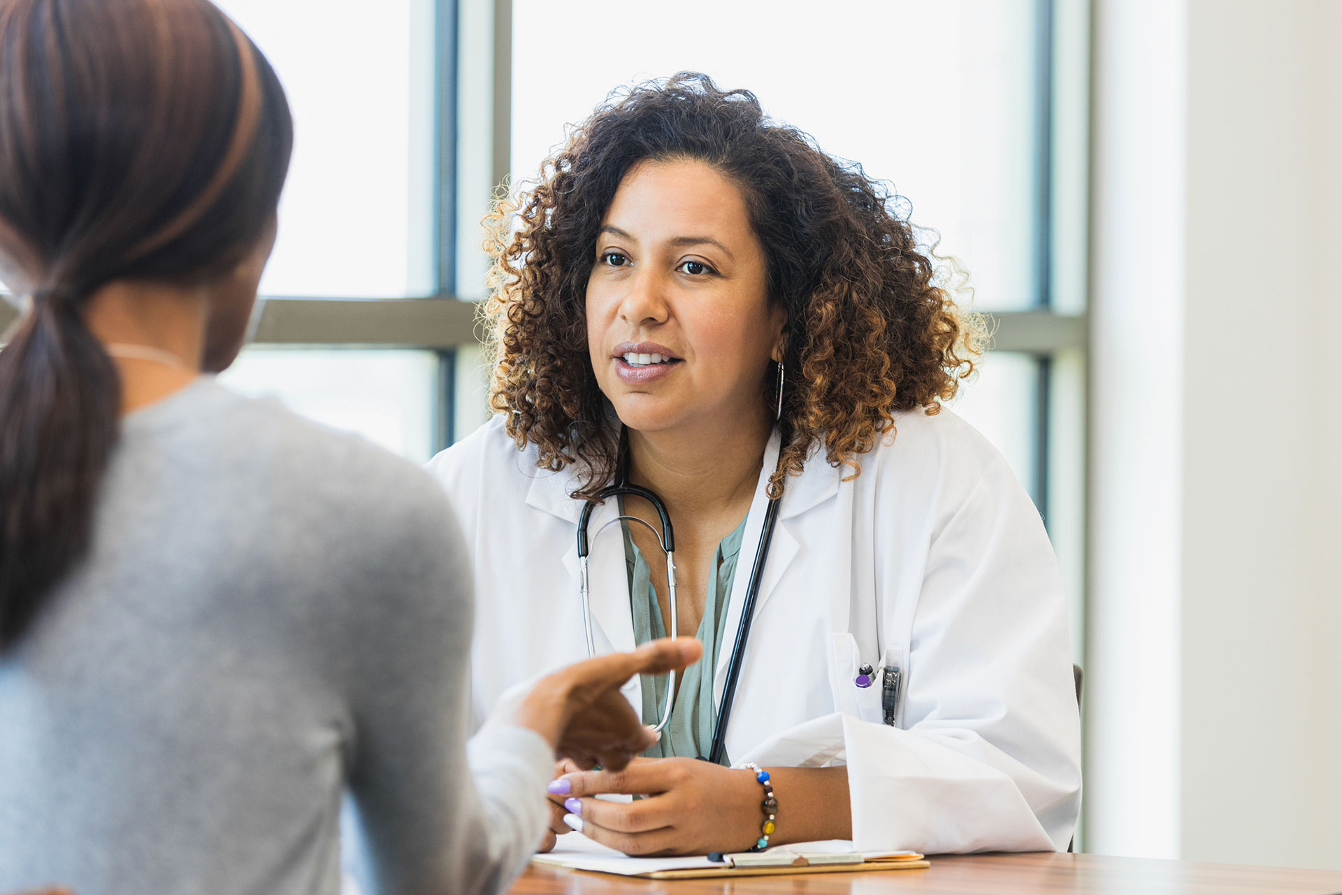 A physician consults a patient